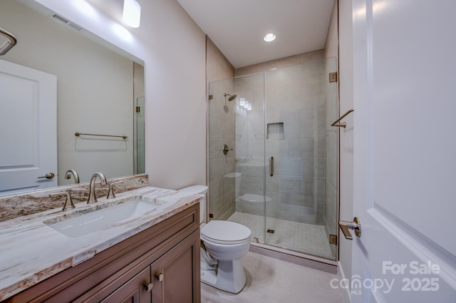 167 Collin Pl Unit 21, Asheville, NC 28804 - bathroom with toilet, vanity, visible vents, a stall shower, and tile patterned flooring