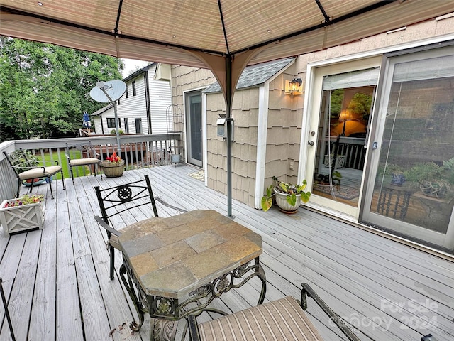 wooden terrace with a gazebo