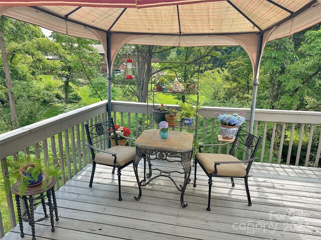 wooden deck with a gazebo