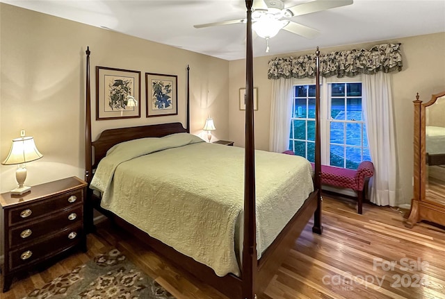 bedroom with ceiling fan and wood-type flooring