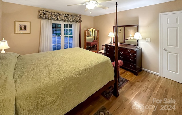 bedroom with ceiling fan and light hardwood / wood-style flooring