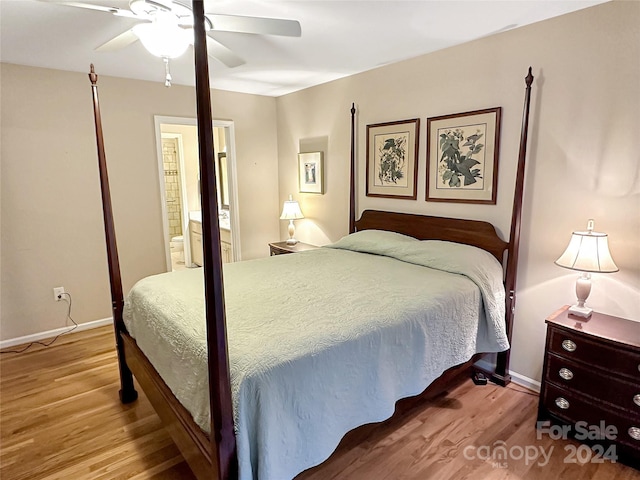 bedroom featuring ceiling fan, connected bathroom, and hardwood / wood-style floors