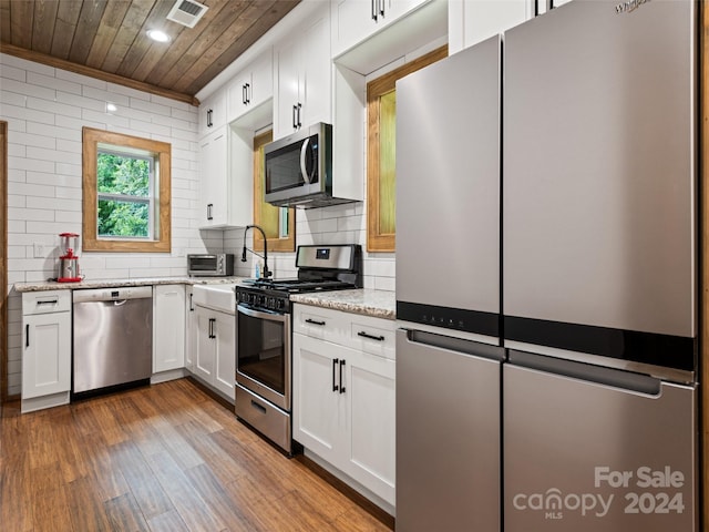 kitchen with white cabinetry, appliances with stainless steel finishes, and wood ceiling