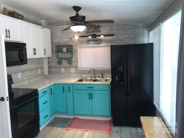 kitchen featuring ceiling fan, sink, blue cabinetry, black appliances, and white cabinetry