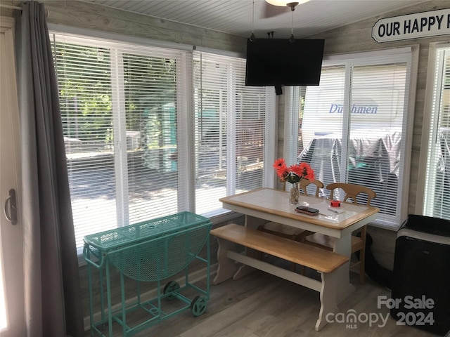 dining space with wood-type flooring