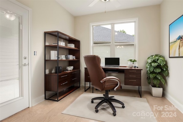 home office featuring ceiling fan and light hardwood / wood-style floors