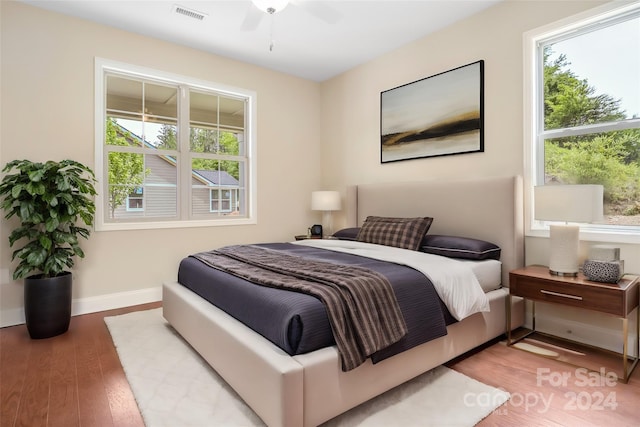 bedroom featuring hardwood / wood-style floors and ceiling fan