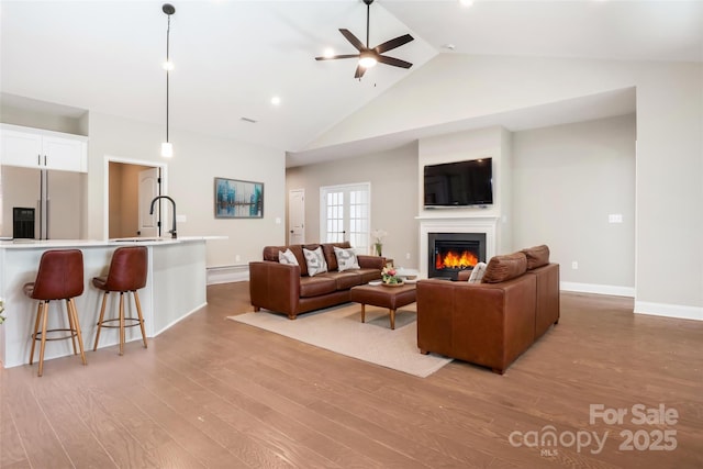 831B Wynnshire Dr Unit 60, Hickory, NC 28601 - living area featuring light wood finished floors, baseboards, a glass covered fireplace, and ceiling fan