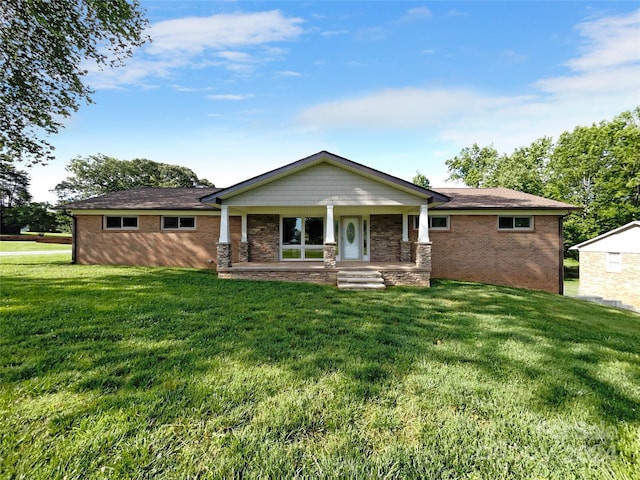 view of front of property with a porch and a front lawn