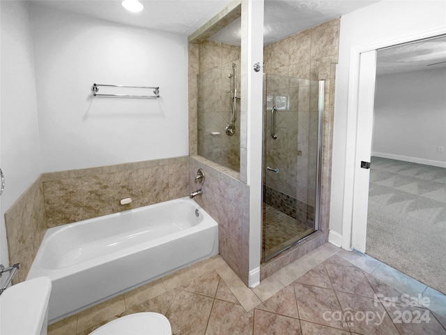 bathroom featuring tile patterned floors and independent shower and bath