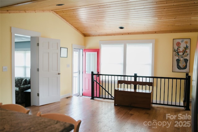 sitting room featuring a wealth of natural light, wood ceiling, vaulted ceiling, and wood finished floors