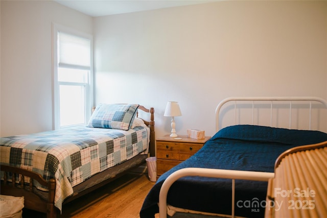 bedroom with wood finished floors