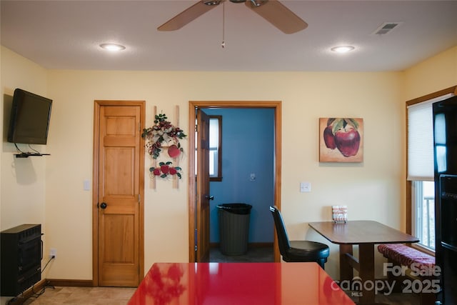 dining room featuring recessed lighting, a ceiling fan, baseboards, visible vents, and heating unit