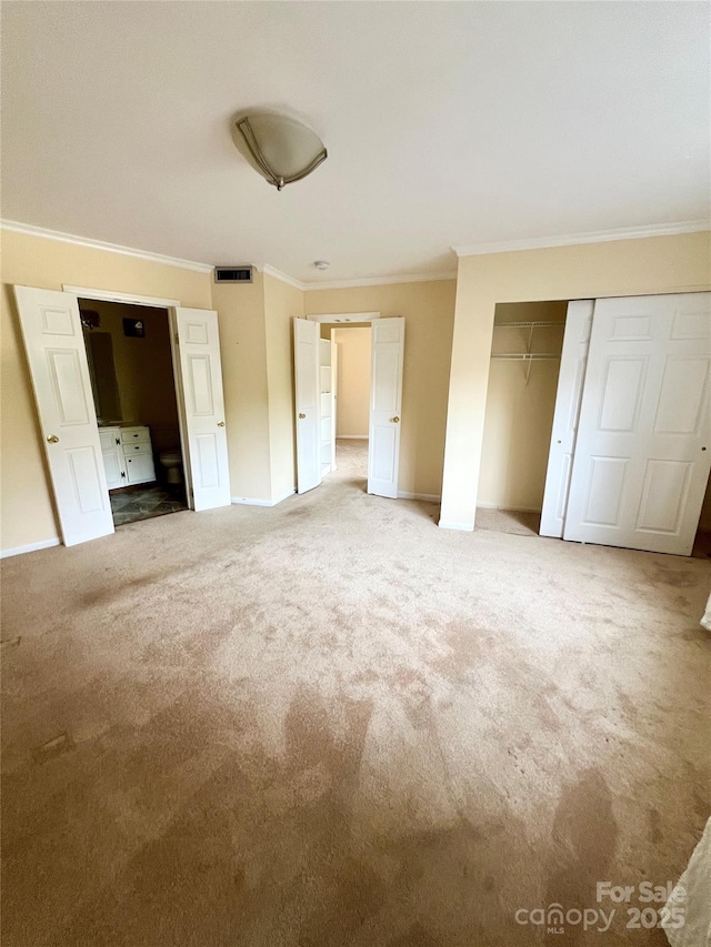 unfurnished bedroom featuring carpet floors and ornamental molding