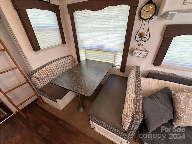 dining space featuring dark wood-type flooring