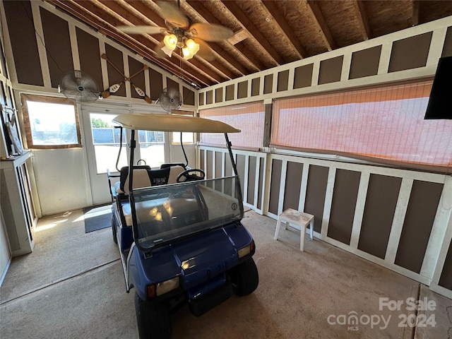 interior space featuring ceiling fan and carpet