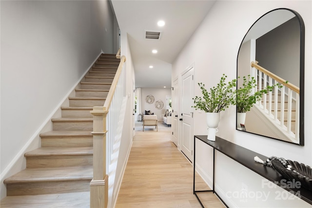 stairway featuring wood-type flooring