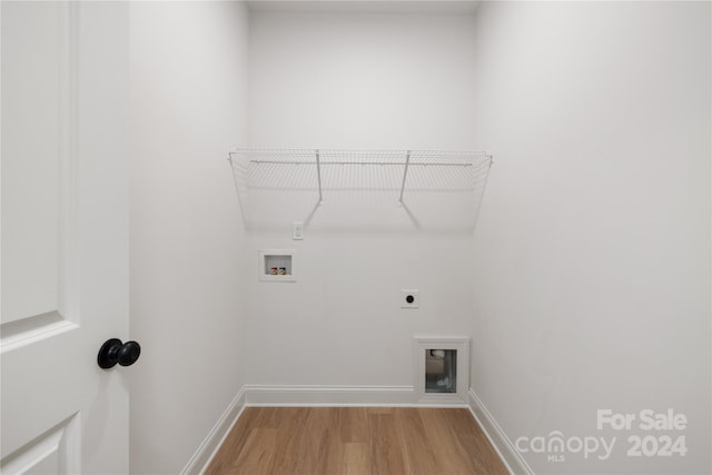 laundry room featuring hardwood / wood-style flooring, hookup for a washing machine, and hookup for an electric dryer