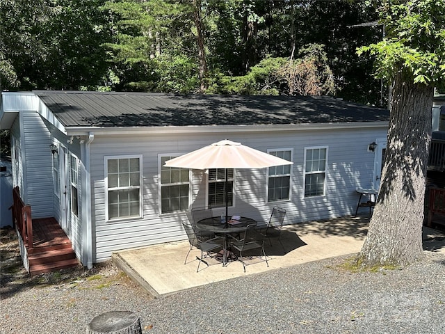 back of property featuring a patio area