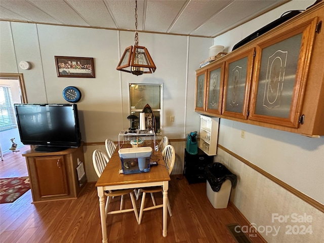 dining room with dark wood-type flooring