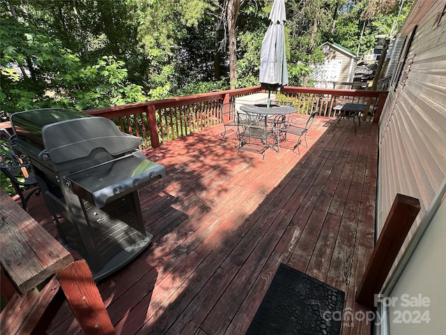 wooden deck featuring grilling area