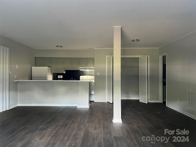 interior space with dark hardwood / wood-style floors and ornamental molding