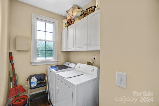 laundry area with cabinets and washing machine and dryer