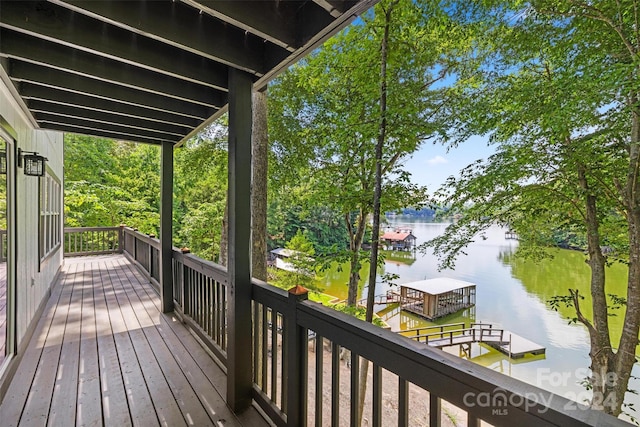 deck featuring a water view and a dock