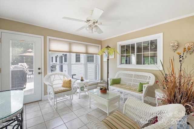 sunroom / solarium featuring ceiling fan and a healthy amount of sunlight