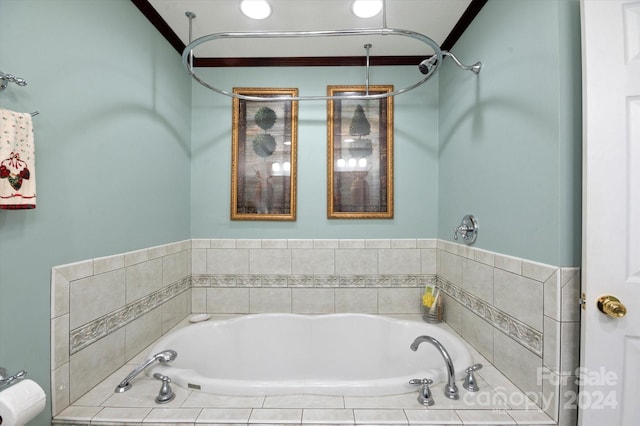 bathroom featuring tiled tub and ornamental molding