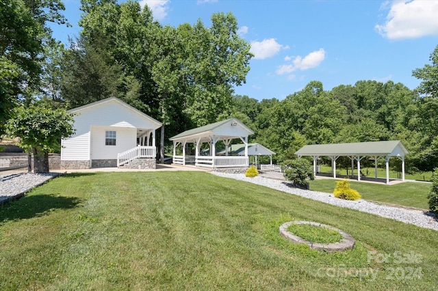 view of property's community with a gazebo and a lawn