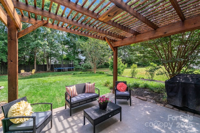 view of patio / terrace featuring a trampoline, area for grilling, and fence