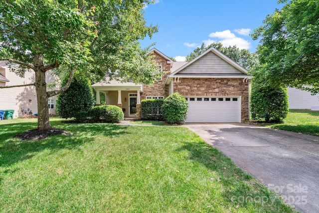 view of front of house with an attached garage, stone siding, a front lawn, and concrete driveway