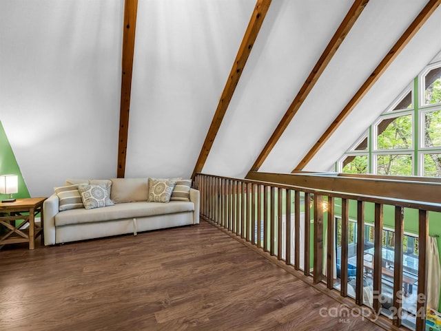 interior space with vaulted ceiling with beams and dark hardwood / wood-style floors