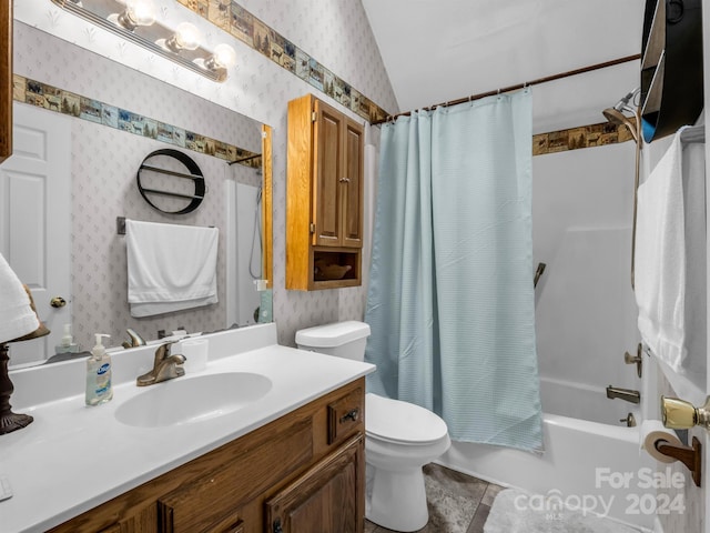 full bathroom featuring toilet, tile patterned flooring, shower / bath combination with curtain, vaulted ceiling, and vanity