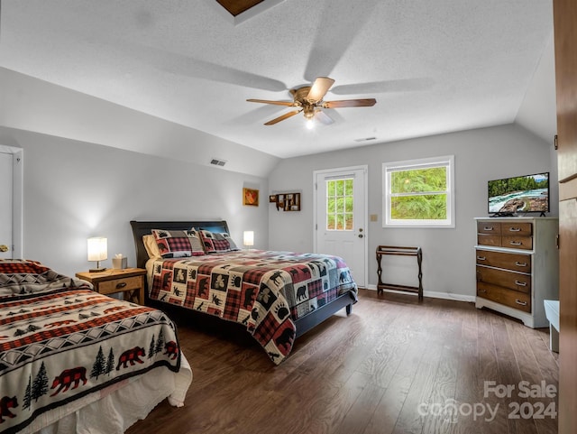 bedroom with ceiling fan, access to outside, dark hardwood / wood-style floors, and lofted ceiling