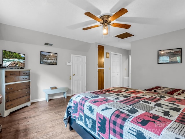 bedroom featuring ceiling fan and hardwood / wood-style flooring