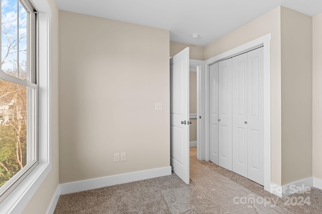 34 Wheeler Rd, Weaverville, NC 28787 - unfurnished bedroom featuring carpet, multiple windows, and a closet