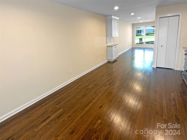 unfurnished room featuring dark hardwood / wood-style flooring