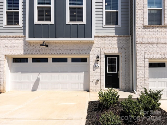 view of exterior entry featuring a garage