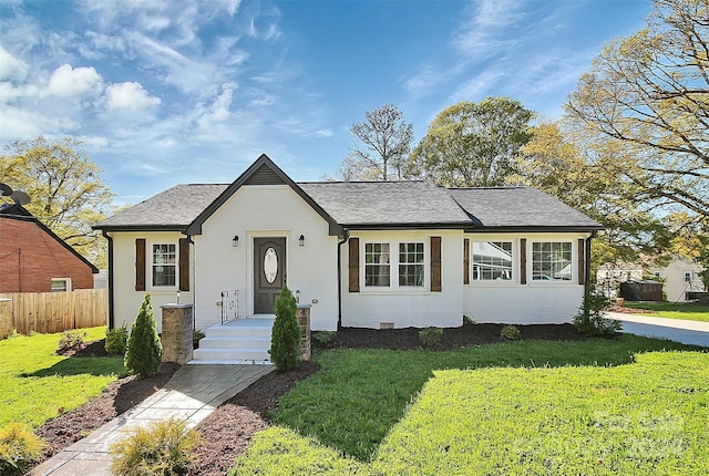 ranch-style home with a front yard