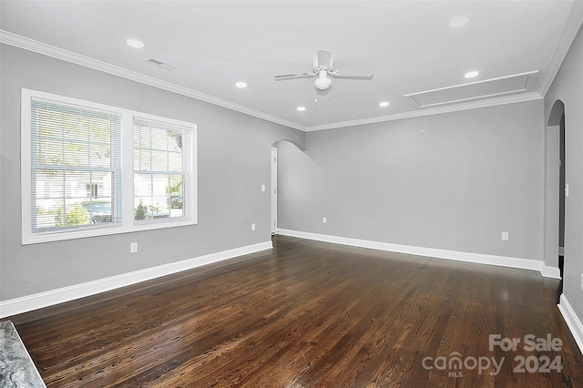 unfurnished room with ceiling fan, dark hardwood / wood-style flooring, and ornamental molding