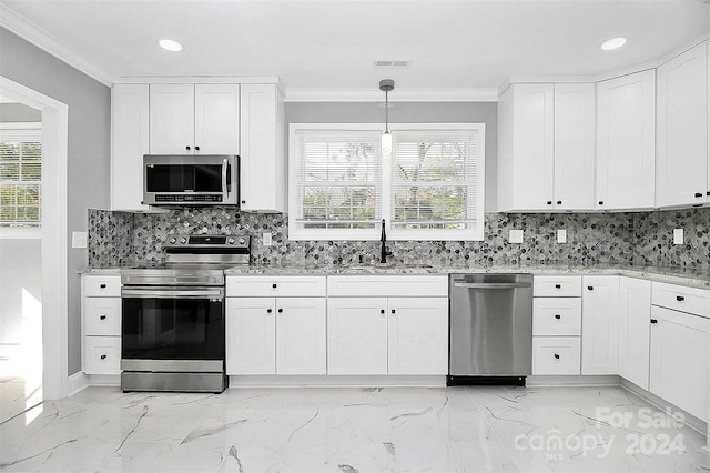 kitchen with white cabinetry, sink, and appliances with stainless steel finishes