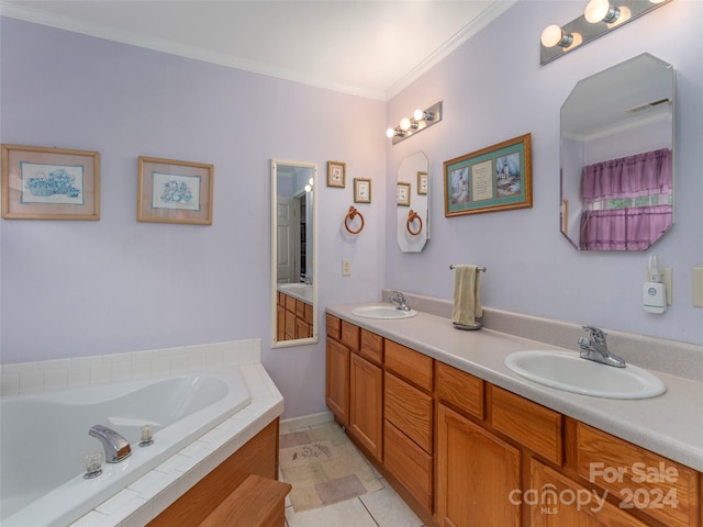 bathroom with crown molding, tile patterned floors, a washtub, and vanity