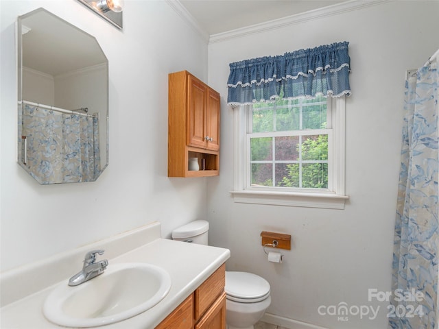 bathroom featuring toilet, ornamental molding, walk in shower, and vanity