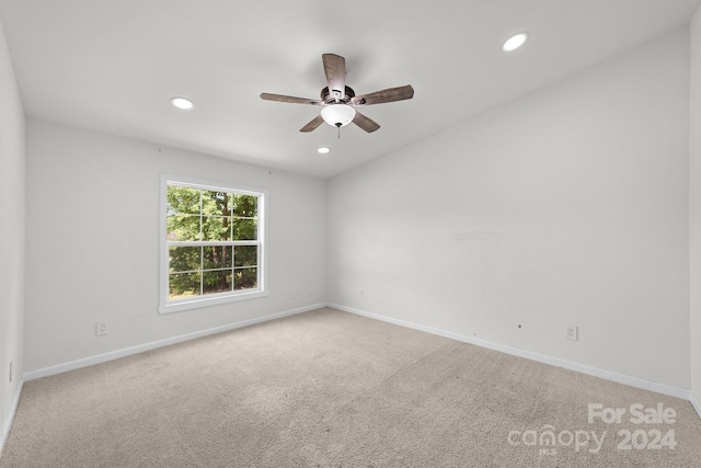 carpeted empty room with ceiling fan