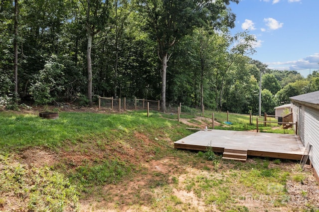 view of yard featuring a wooden deck