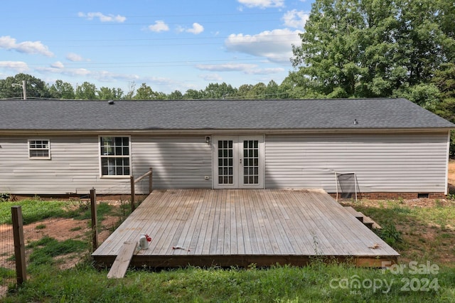 rear view of property featuring french doors and a deck