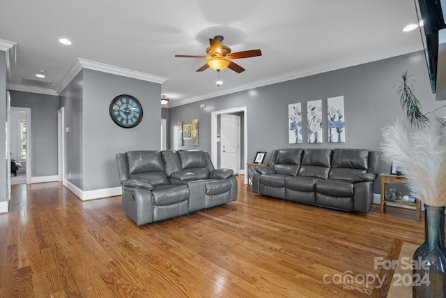 living room featuring ceiling fan, hardwood / wood-style floors, and ornamental molding