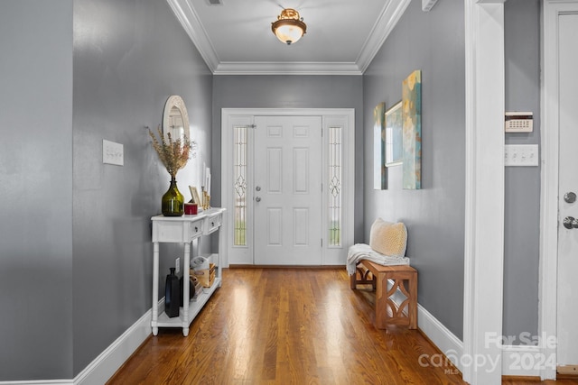 foyer entrance featuring hardwood / wood-style floors and ornamental molding